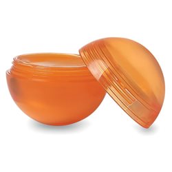 Bola con tapa naranja y bálsamo labial en el interior testado dermatológicamente